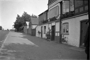 A black and white photo of two people

Description automatically generated
